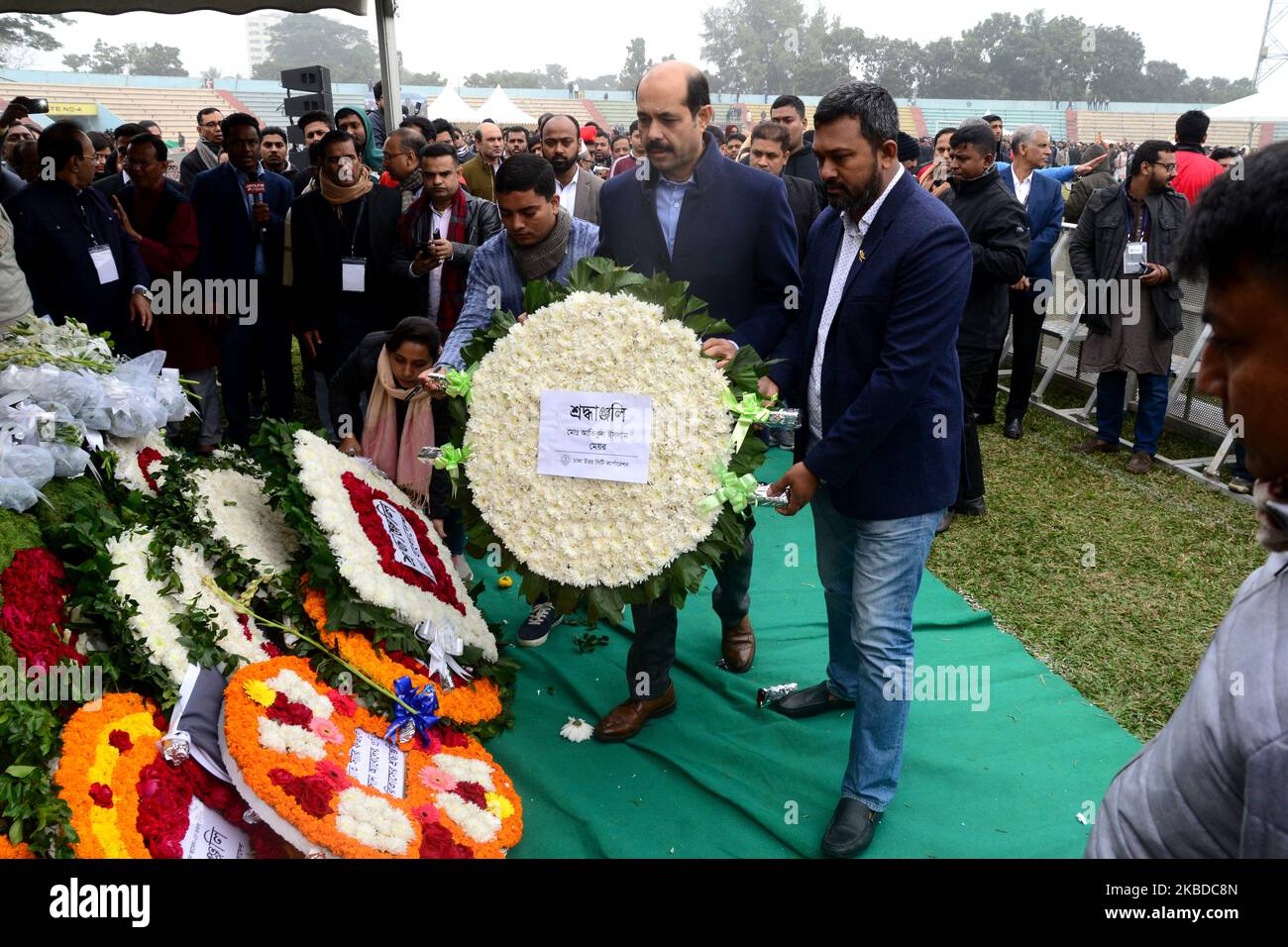 People pay their respects to the late Sir Fazle Hasan Abed, the founder of the Bangladesh Rural Advancement Committee (BRAC), in Dhaka, Bangladesh, on December 22, 2019. Thousands gathered in Bangladesh's capital on December 22 to attend the funeral of Sir Fazle Hasan Abed, founder of BRAC, one of the world's largest NGOs, to show their final respect. (Photo by Mamunur Rashid/NurPhoto) Stock Photo