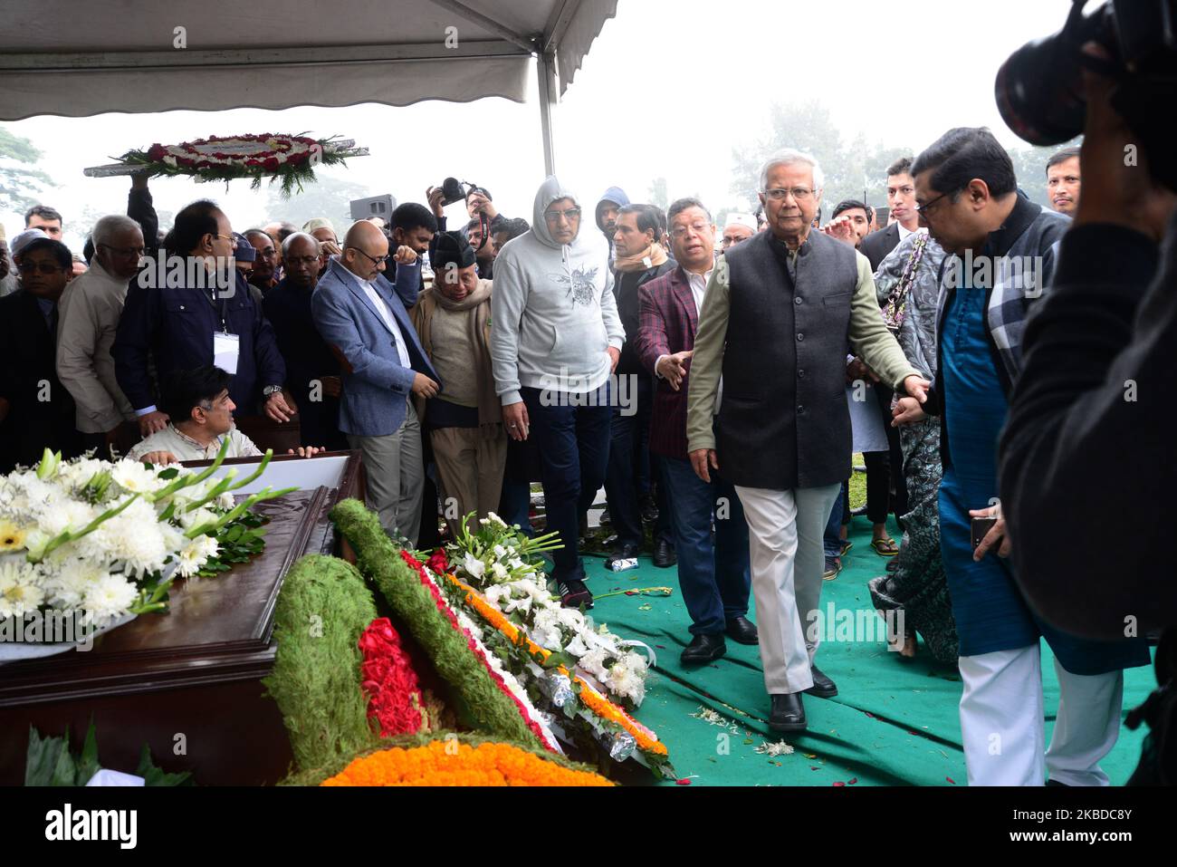 People pay their respects to the late Sir Fazle Hasan Abed, the founder of the Bangladesh Rural Advancement Committee (BRAC), in Dhaka, Bangladesh, on December 22, 2019. Thousands gathered in Bangladesh's capital on December 22 to attend the funeral of Sir Fazle Hasan Abed, founder of BRAC, one of the world's largest NGOs, to show their final respect. (Photo by Mamunur Rashid/NurPhoto) Stock Photo