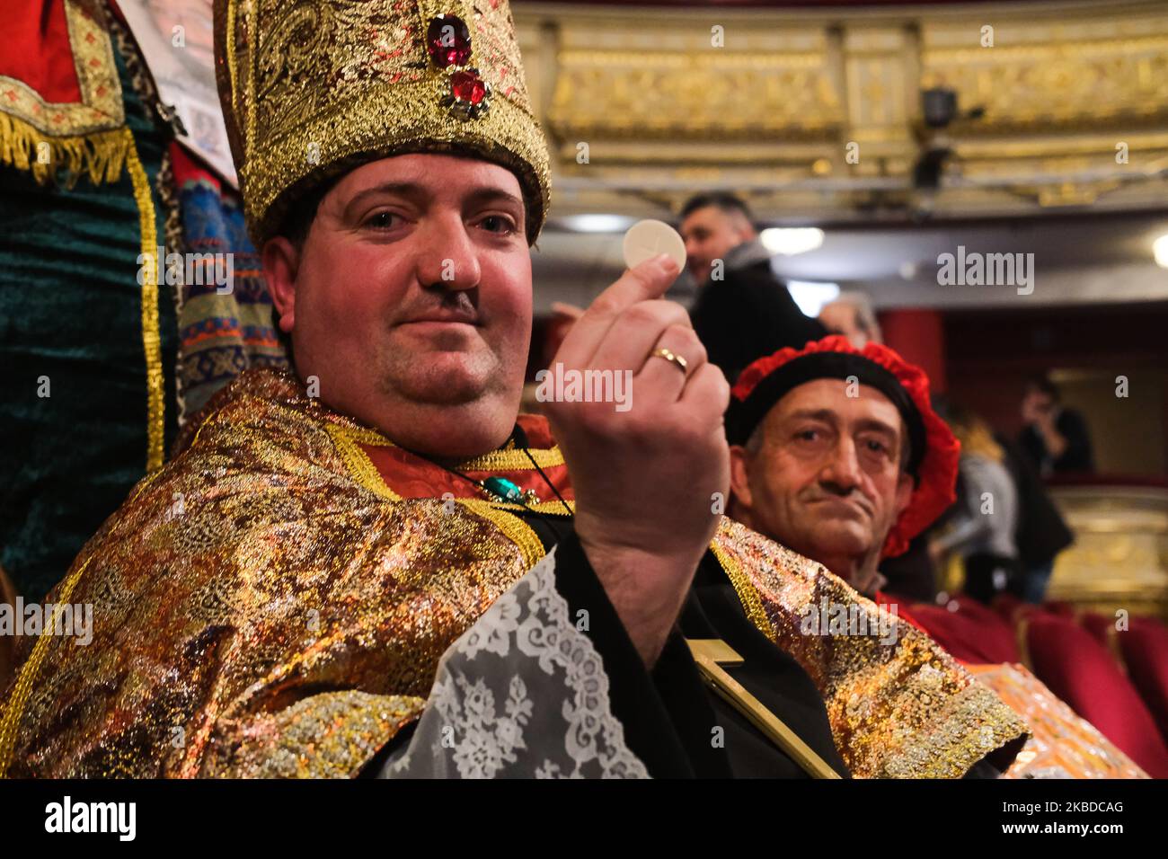 An spectator wearing a fancy dress attends to the draw of Spain's Christmas lottery named 'El Gordo' (Fat One) at the Teatro Real on December 22, 2019 in Madrid, Spain. This year's winning number is 26590, with a total of 4 million euros for the top prize to be shared between ten ticket holders. (Photo by Antonio Navia/NurPhoto) Stock Photo