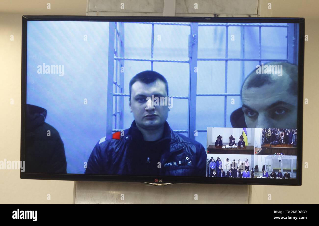 Ex-members of riot police Berkut Serhii Zinchenko,Pavlo Abroskin and Oleh Yanyshevsky, who accused in killing protestors during the Euromaidan or the Revolution of Dignity 2013-14, attend a court hearing via video link, at the Court of Appeal in Kyiv, Ukraine, on 27 December, 2019. (Photo by STR/NurPhoto) Stock Photo