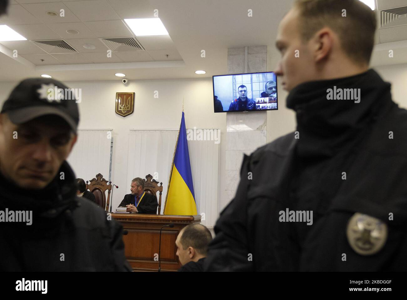 Ex-members of riot police Berkut Serhii Zinchenko,Pavlo Abroskin and Oleh Yanyshevsky, who accused in killing protestors during the Euromaidan or the Revolution of Dignity 2013-14, attend a court hearing via video link, at the Court of Appeal in Kyiv, Ukraine, on 27 December, 2019. (Photo by STR/NurPhoto) Stock Photo