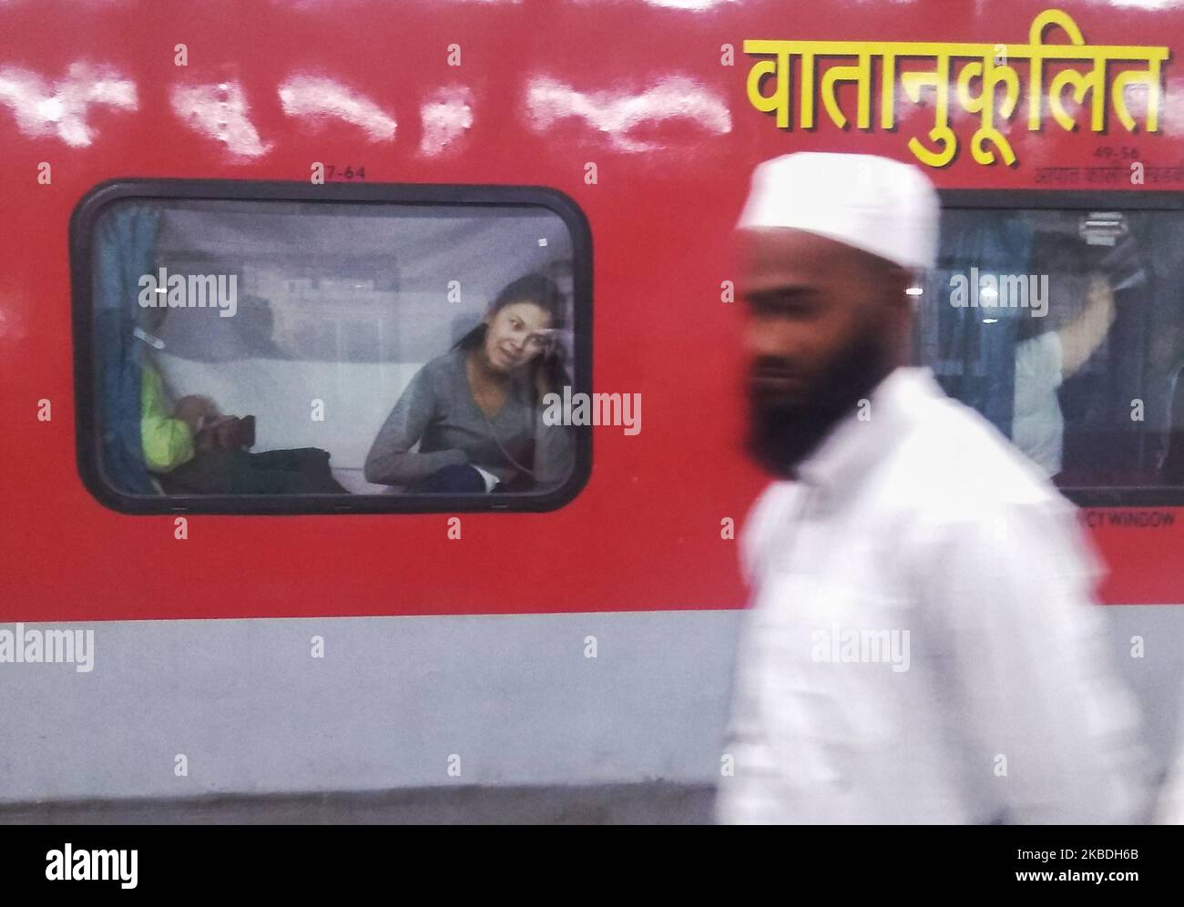 A woman talks on a mobile phone inside a train at New Jalpaiguri Railway Station, India, 27 December, 2019. (Photo by Indranil Aditya/NurPhoto) Stock Photo
