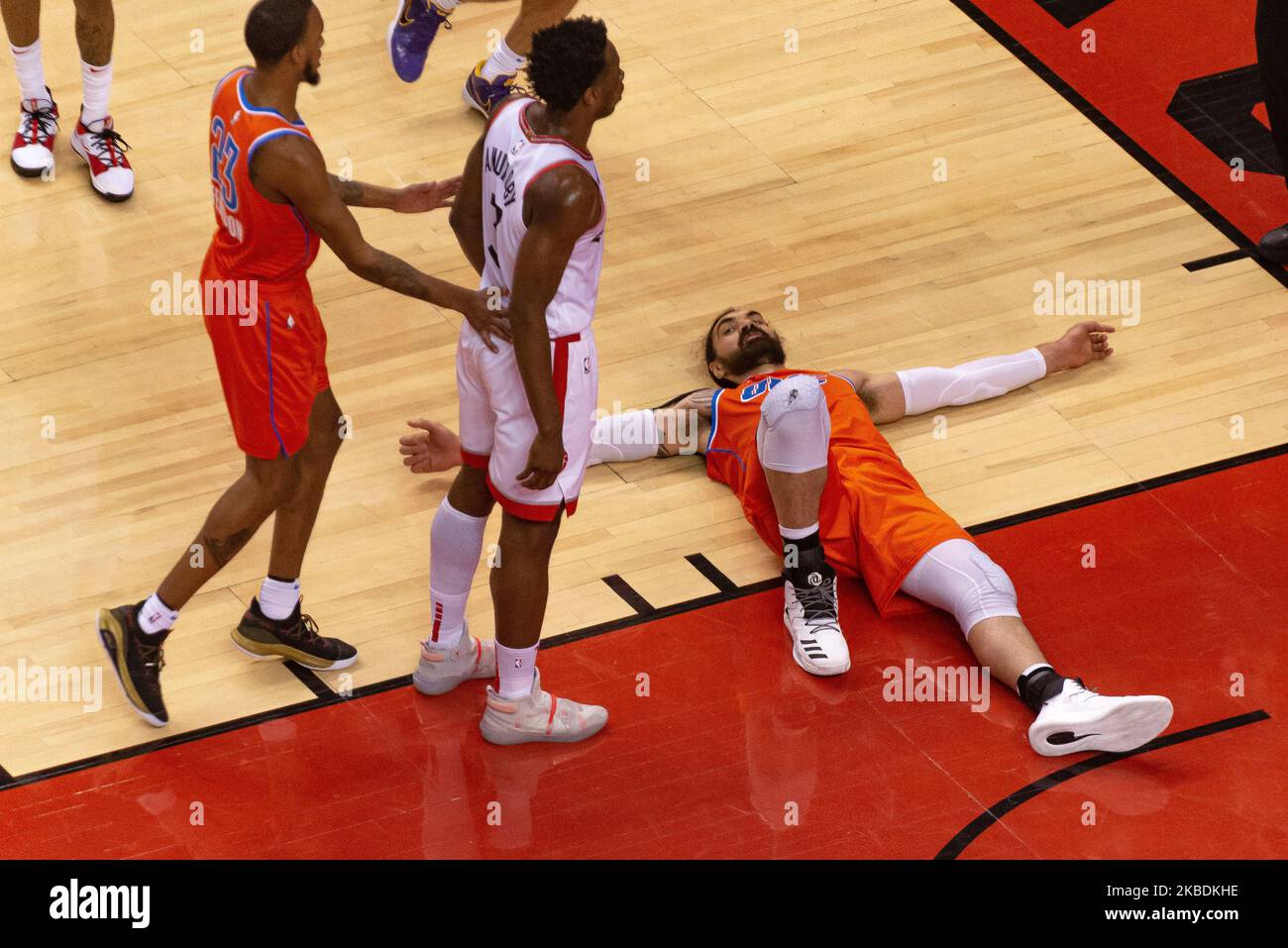 Steven Adams #12 of the Oklahoma City Thunder on the floor after collision during the Toronto Raptors vs Oklahoma City Thunder NBA regular season game at Scotiabank Arena on December 29, 2019, in Toronto, Canada (Oklahoma City Thunder won 98:97) (Photo by Anatoliy Cherkasov/NurPhoto) Stock Photo