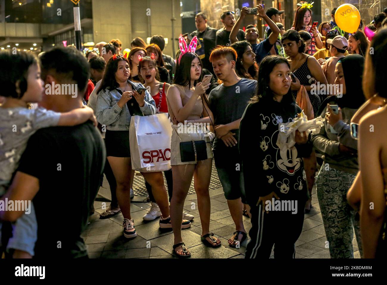 People wait to celebrate New Years eve in Kuala Lumpur on December 31, 2019. (Photo by Mohd Daud