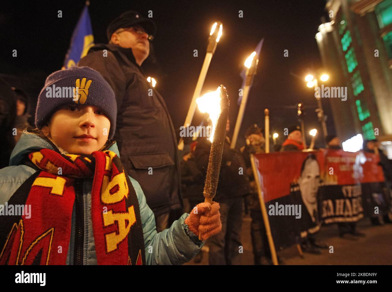 Ukrainians attend a torchlight procession dedicated to the 111th of Stepan Bandera birthday in center of Kyiv, Ukraine, on 1 January 2020. Members and supporters of 'Svoboda' ('Freedom') nationalistic party attended the torch march to mark leader and ideologist of Ukrainian national movement Stepan Bandera birthday. (Photo by STR/NurPhoto) Stock Photo