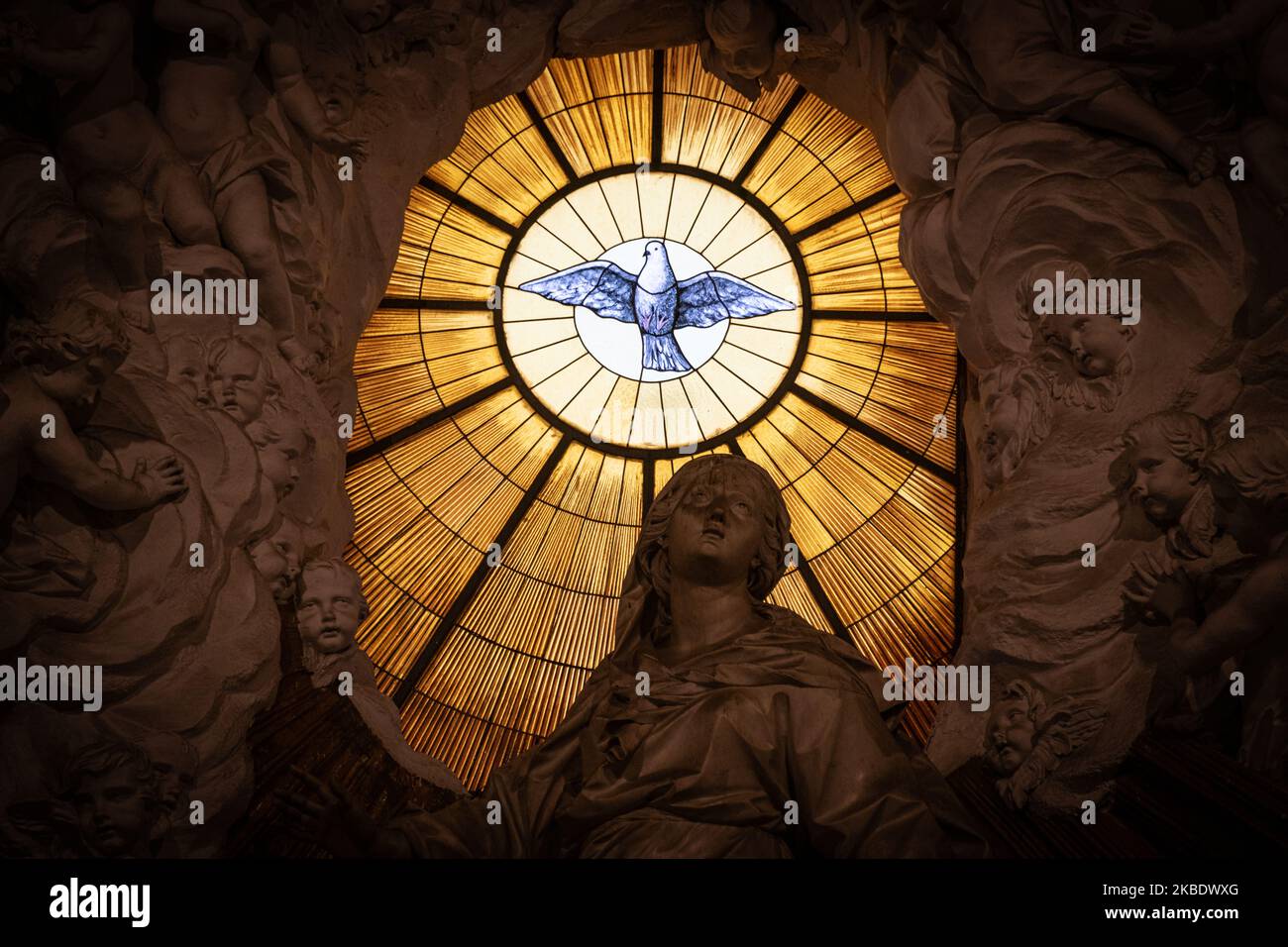 A stained glass window depicting a the Christian symbol of a white dove ...