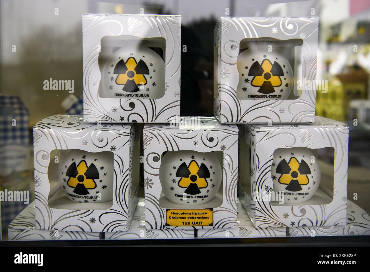 Christmas decorations with a symbol of radiation danger on the shop ...