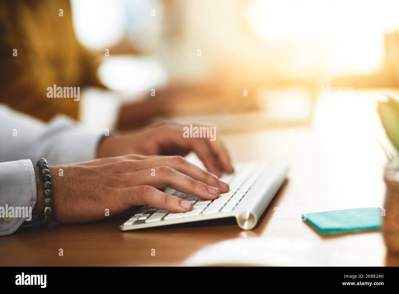 Always connected. Always online. Always ready to help. an unrecognizable man typing on a keyboard. Stock Photo