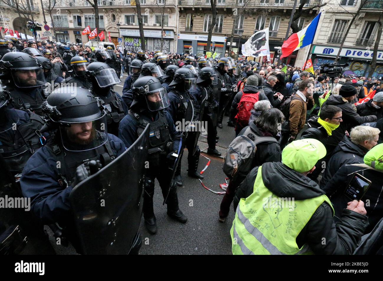 CRS riot policemen stand in front of protesters during a demonstration in Paris, on January 9, 2020, on the 36th day of a nationwide multi-sector strike against French government's pensions overhaul. (Photo by Michel Stoupak/NurPhoto) Stock Photo