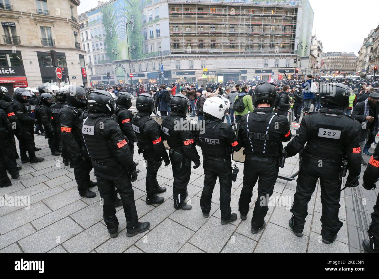 CRS riot policemen stand in front of protesters during a demonstration in Paris, on January 9, 2020, on the 36th day of a nationwide multi-sector strike against French government's pensions overhaul. (Photo by Michel Stoupak/NurPhoto) Stock Photo