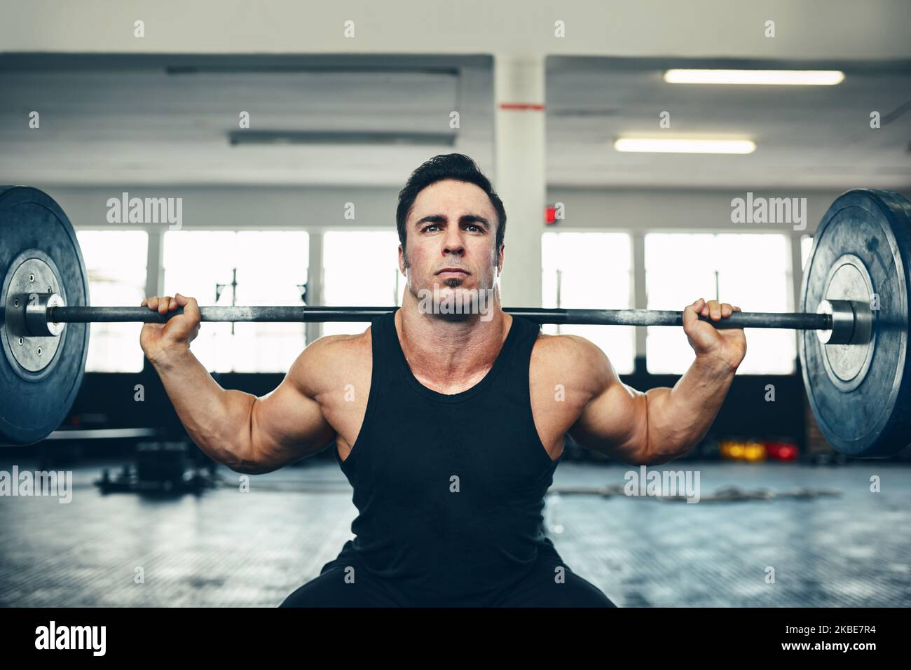 Get fit and do the lift. a man lifting weights at the gym Stock Photo