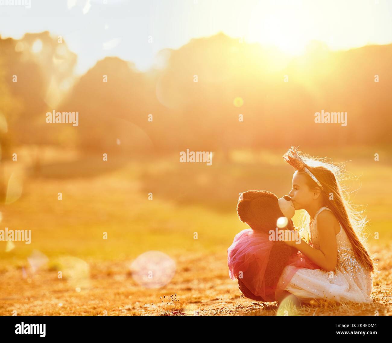 You are my best friend forever. an adorable little girl playing with her teddybear outdoors. Stock Photo