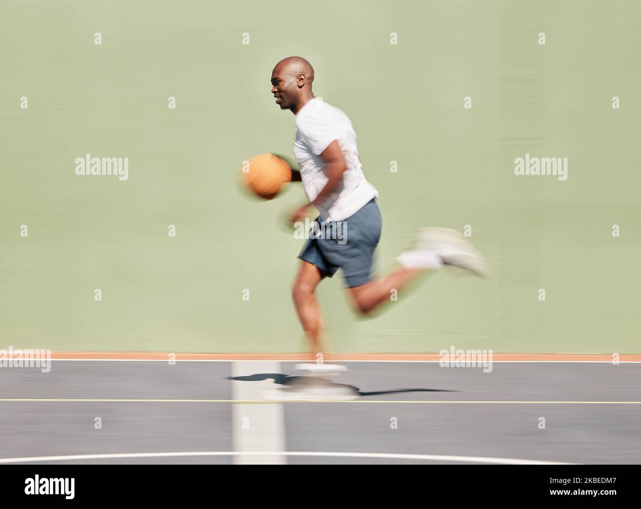 Fitness, sports and black man running on basketball court in training