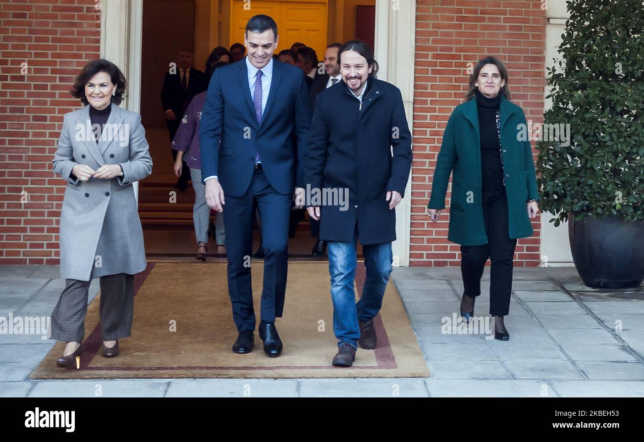 Spain's Prime Minister Pedro Sanchez (2nd L), Spain's Deputy Prime Minister and Minister of Presidency and Relations with Parliament Carmen Calvo (L), Spain's Deputy Prime Minister for Social Rights and Sustainable Development Pablo Iglesias (R) and Spain's Deputy Prime Minister of Ecological Transition and Demographic Challenge Teresa Ribera (2nd R) are seen ahead of the first cabinet meeting of the new government in Madrid, Spain on January 14, 2020. (Photo by Oscar Gonzalez/NurPhoto) Stock Photo