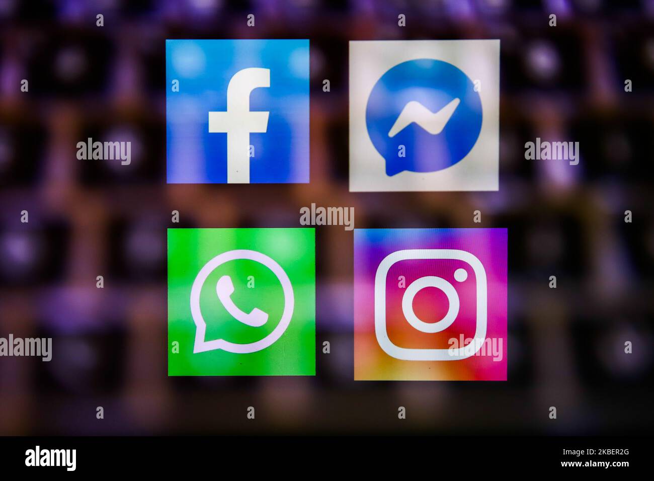 Facebook, Messenger, WhatsApp and Instagram logos displayed on a phone