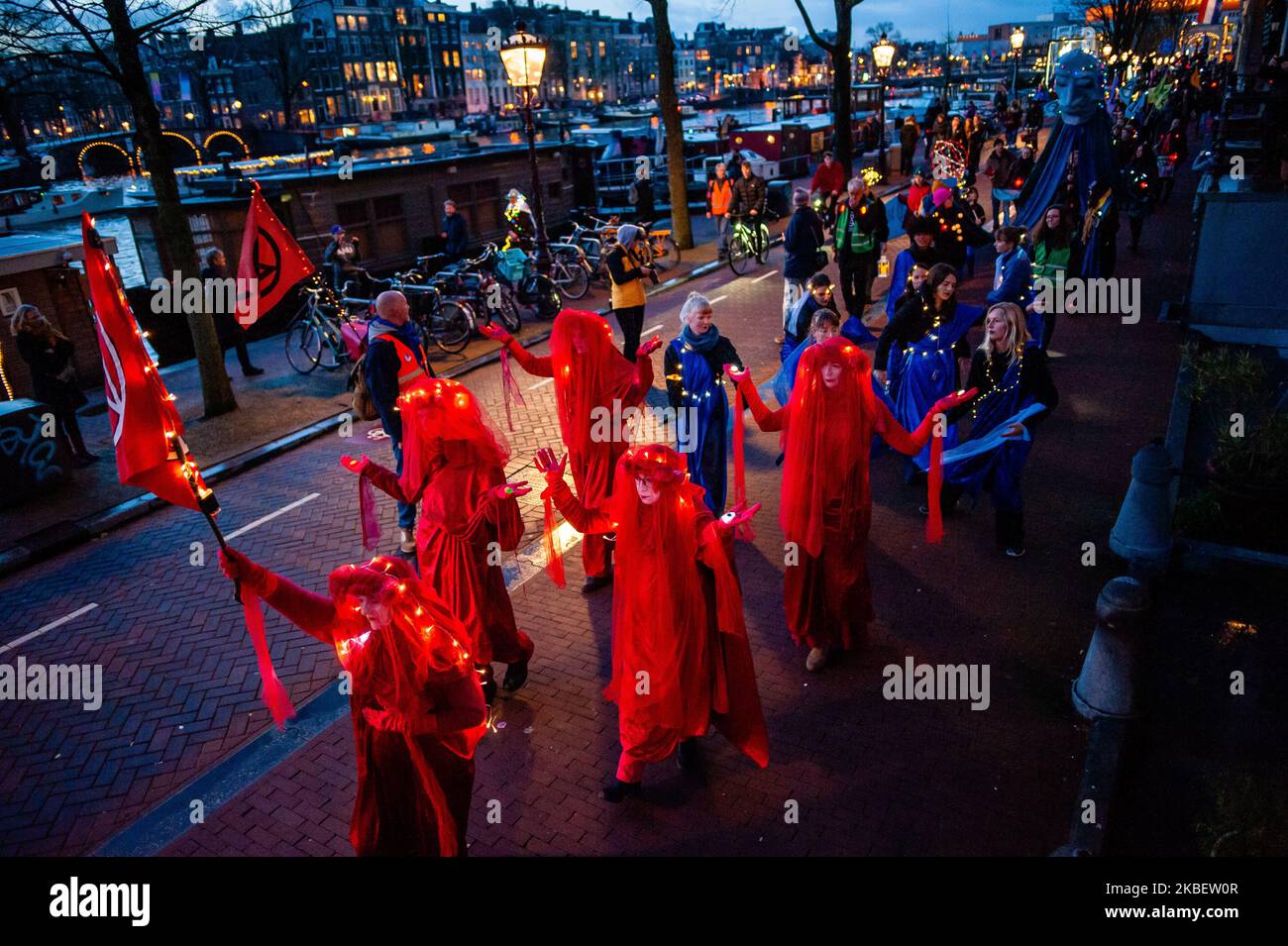 Extinction Rebellion activists are walking behind the Red Rebel Brigade during the Extinction Rebellion artistic march, in Amsterdam, on January 18th, 2020 (Photo by Romy Arroyo Fernandez/NurPhoto) Stock Photo