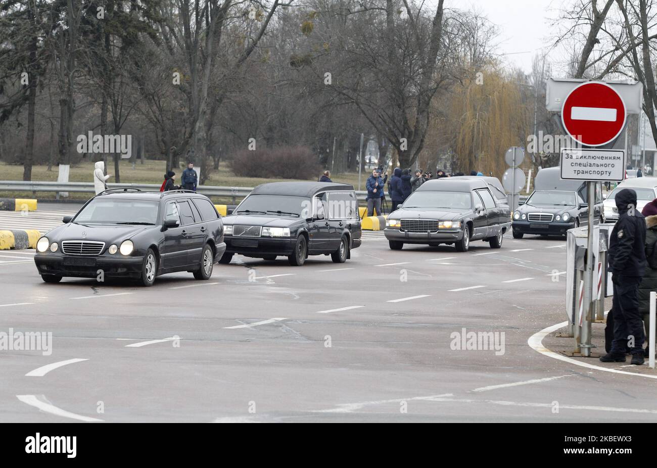 A motorcade of hearses with the bodies of Ukrainians, victims in the crash of the flight 752 of the Ukraine International Airlines in Iran, are seen upon arrival to the Boryspil Airport near Kiev, Ukraine, on 19 January, 2020. The bodies of Ukrainians, 9 crew members of the Ukraine International Airlines (UIA) and 2 passengers, dead the plane crash in Iran, were handed over from Iran to Ukraine. (Photo by STR/NurPhoto) Stock Photo
