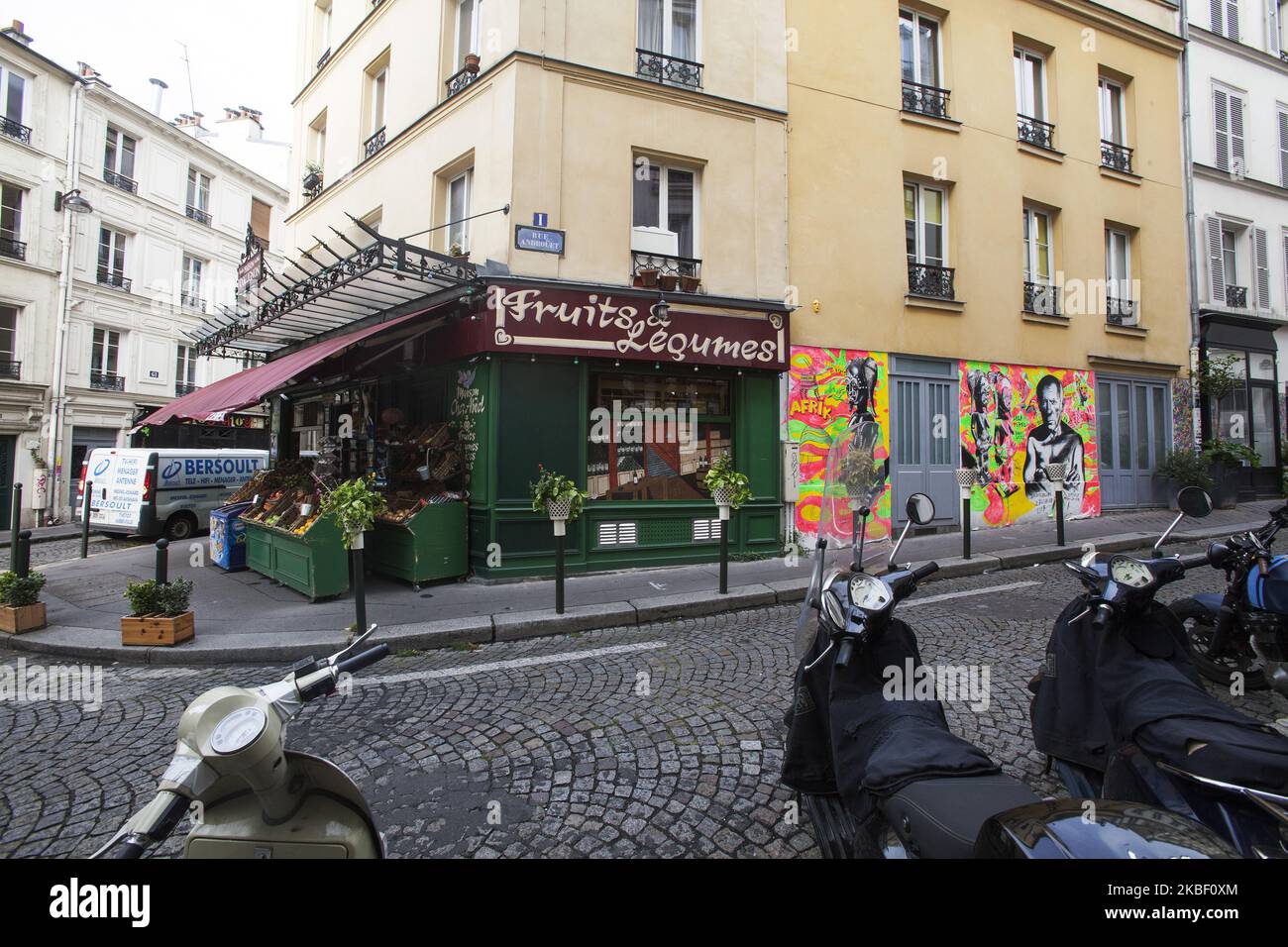 Maison Collignon 56 Rue des Trois Freres with a fruit and vegetable market at the Montmartre, Paris, France on 13 September 2019. The store The Marche de la Butte has become famous thanks to the movie Amelie from Montmartre. Many scenes of the film were shot at this location. A graffiti with Pablo Picasso pictured on the right. (Photo by Krystof Kriz/NurPhoto) Stock Photo