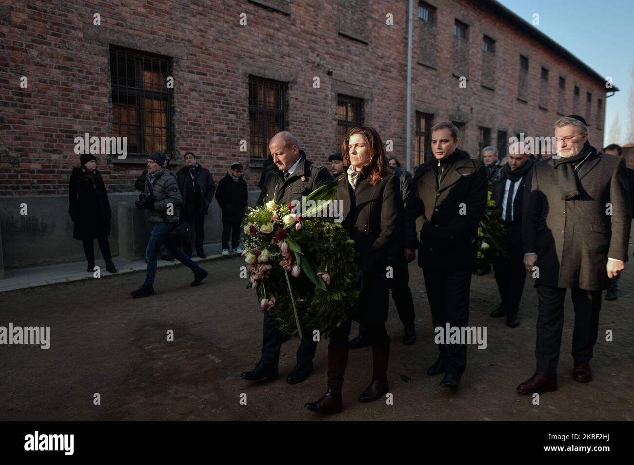 Judit Varga (C), Hungarian Minister of Justice, walks inside Auschwitz I former Nazi concentration camp gate, during a second day of 'Delegation to Auschwitz' event. On tuesday, January 21, 2020, in Auschwitz I concentration camp, Oswiecim, Poland. (Photo by Artur Widak/NurPhoto) Stock Photo