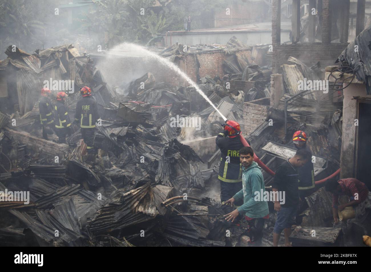 Bangladeshi firefighters extinguish a fire that broke out at Chalantika ...