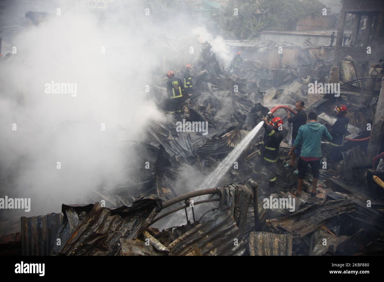 Bangladeshi firefighters extinguish a fire that broke out at Chalantika ...