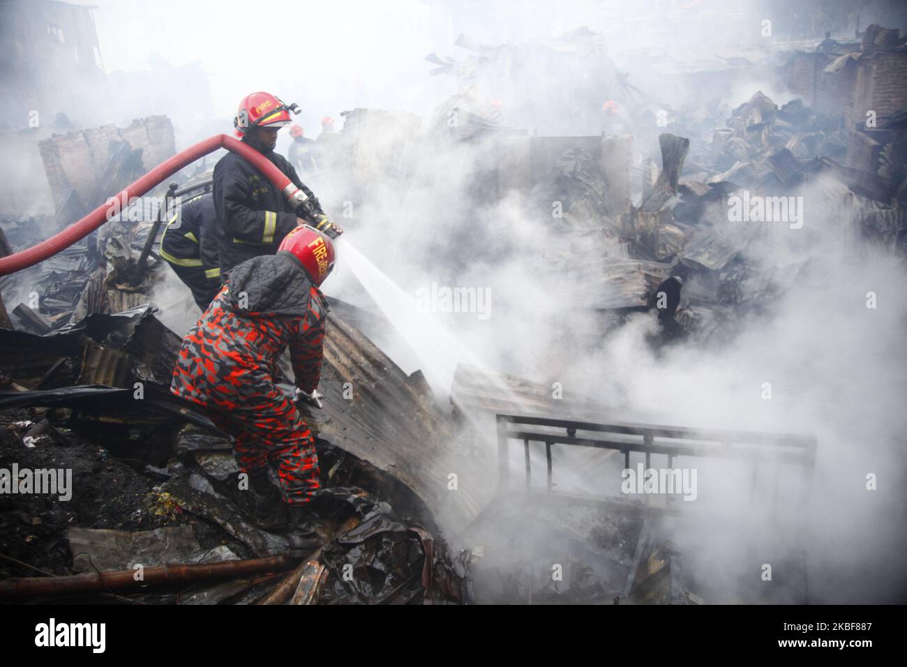 Bangladeshi firefighters extinguish a fire that broke out at Chalantika ...