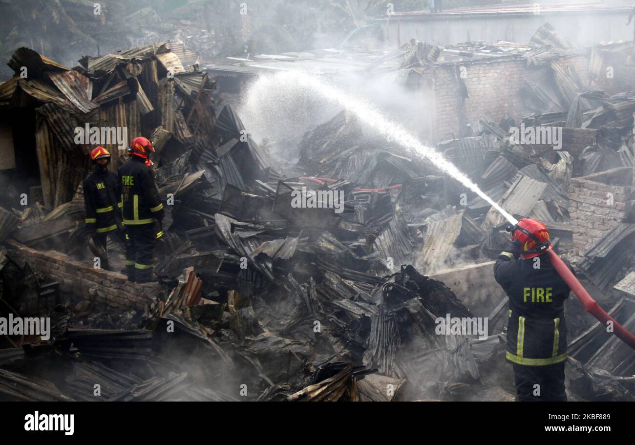 Bangladeshi firefighters extinguish a fire that broke out at Chalantika ...