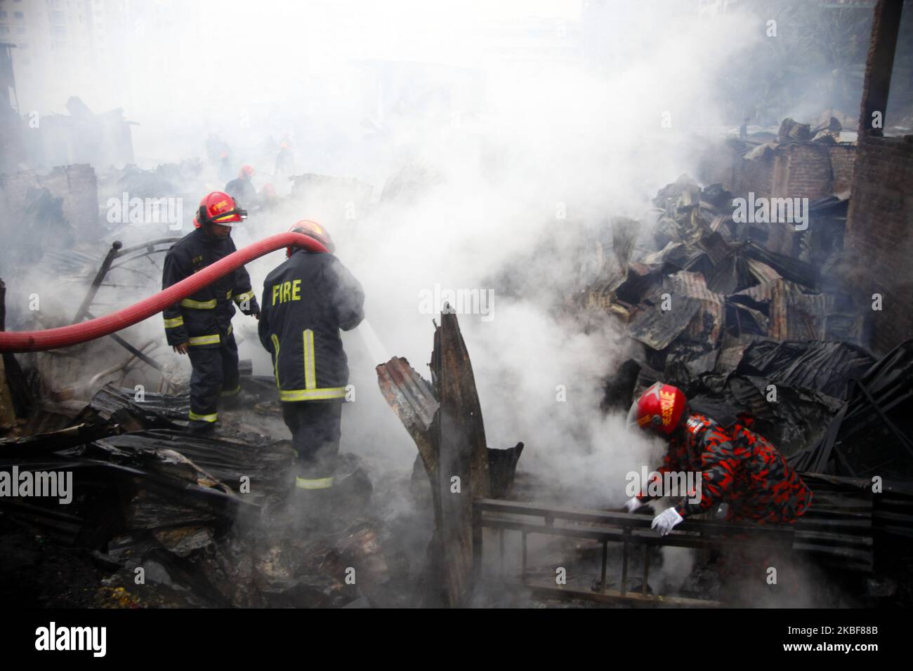 Bangladeshi firefighters extinguish a fire that broke out at Chalantika ...