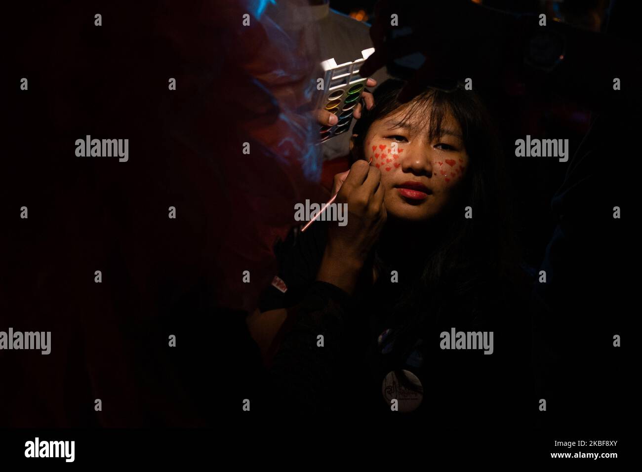 A girl paints her face during the ”&Proud' LGBT festival in Yangon, Myanmar on 24 January, 2020. (Photo by Shwe Paw Mya Tin/NurPhoto) Stock Photo