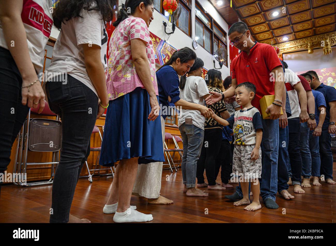 Chinese descendants shook hands after praying for the Chinese New Year