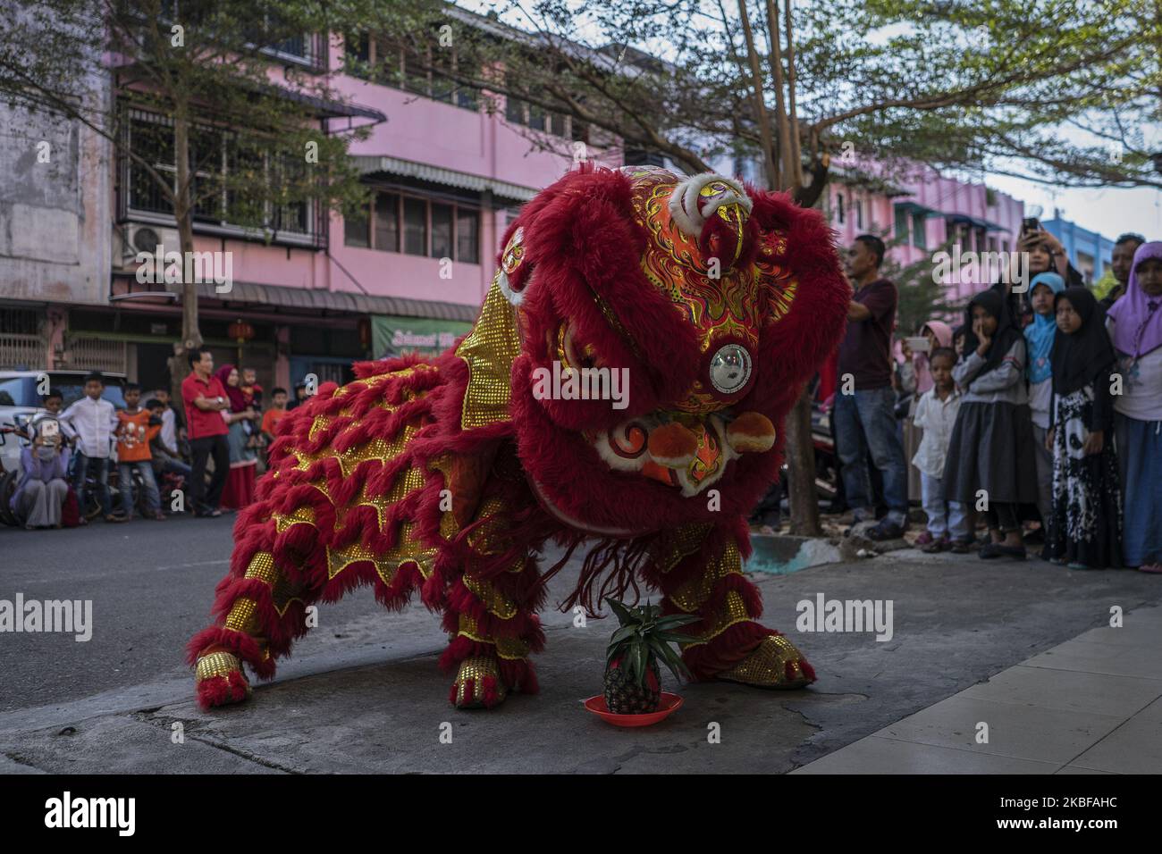 A group of dancers perform the Chinese traditional dragon dance during ...