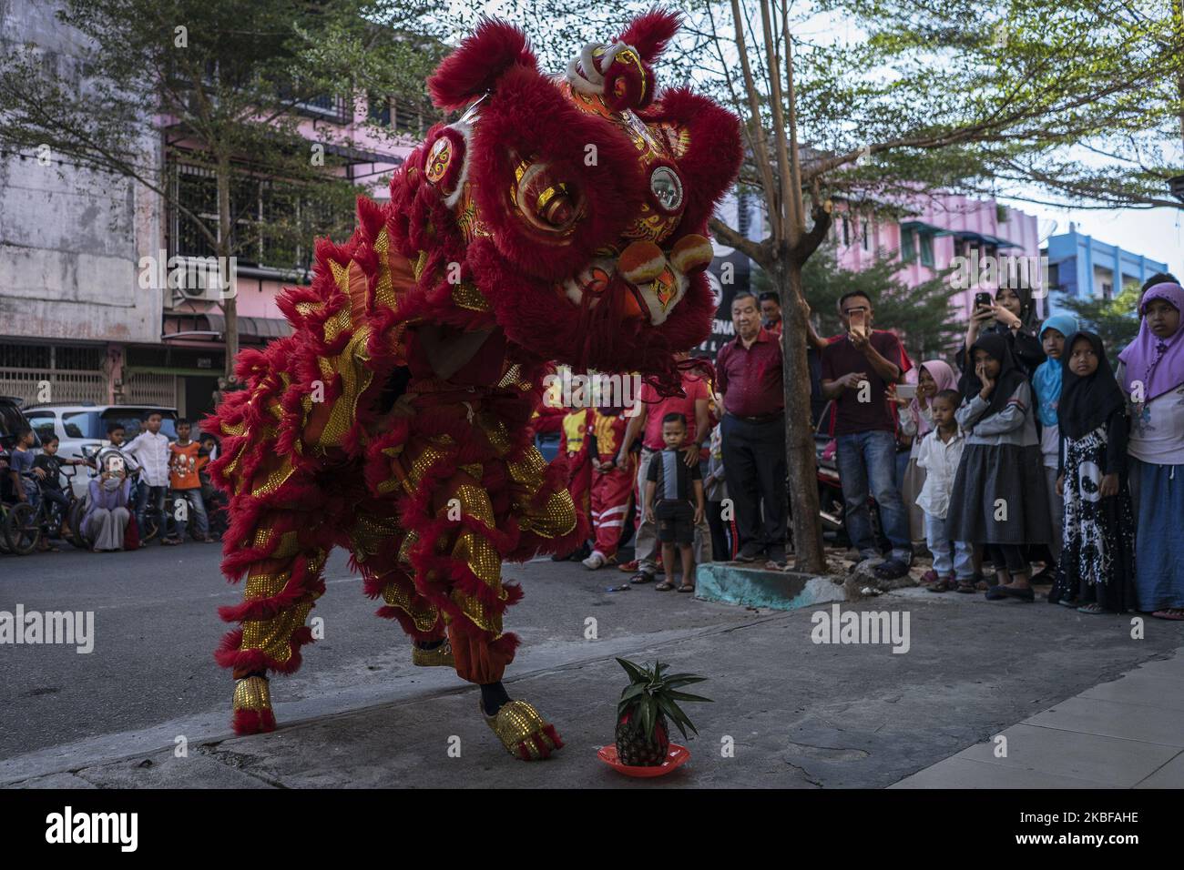 A group of dancers perform the Chinese traditional dragon dance during ...