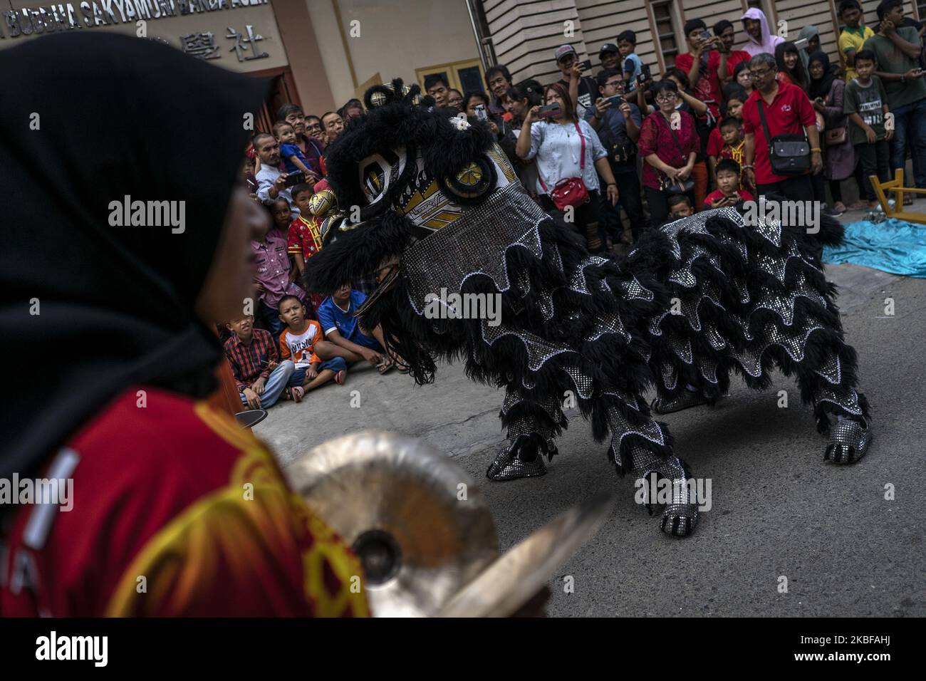 A group of dancers perform the Chinese traditional dragon dance during ...