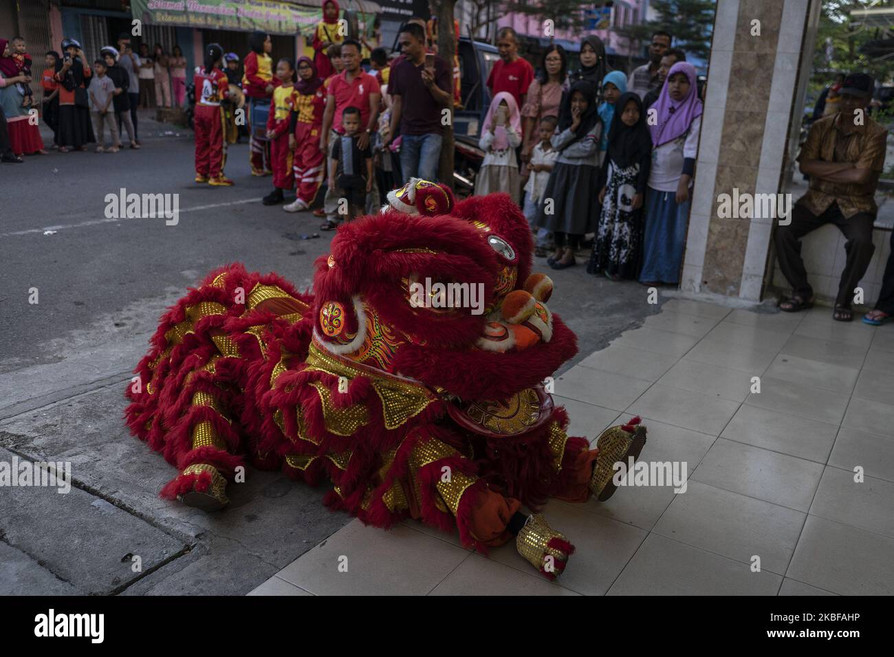 A group of dancers perform the Chinese traditional dragon dance during ...
