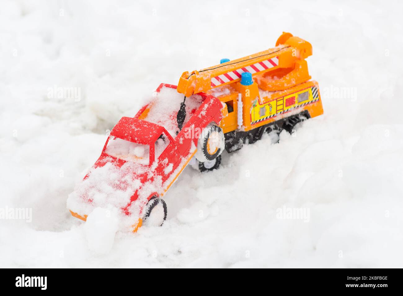 Two toys cars winter in the snow at play time Stock Photo