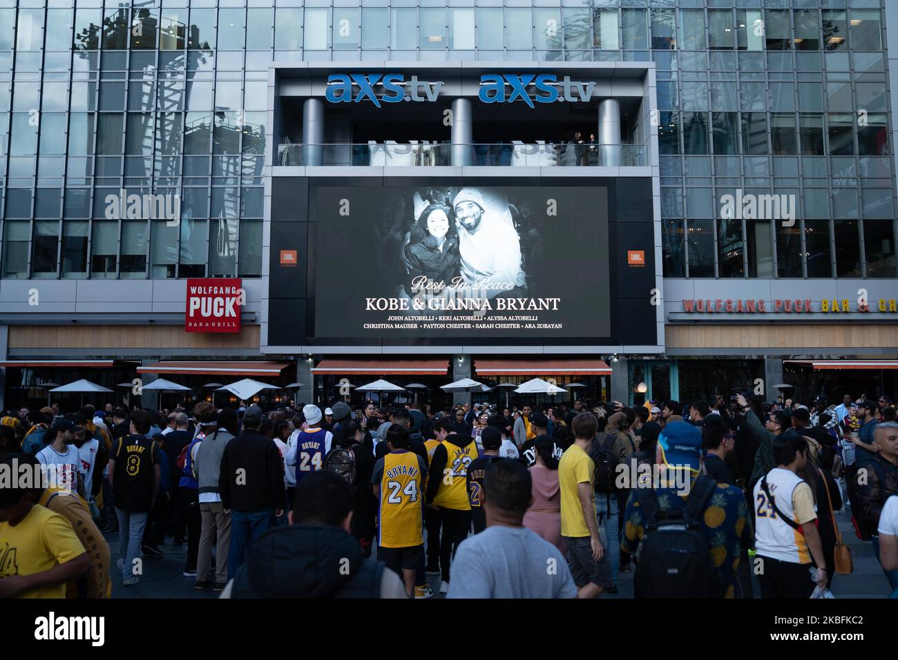 Fans gather at a makeshift memorial to mourn the death of NBA legend Kobe Bryant, who was killed along with his daughter and seven others in a helicopter crash on January 26, at LA Live plaza in front of Staples Center in Los Angeles on January 27, 2020. - (Photo by Brent Combs/NurPhoto) Stock Photo