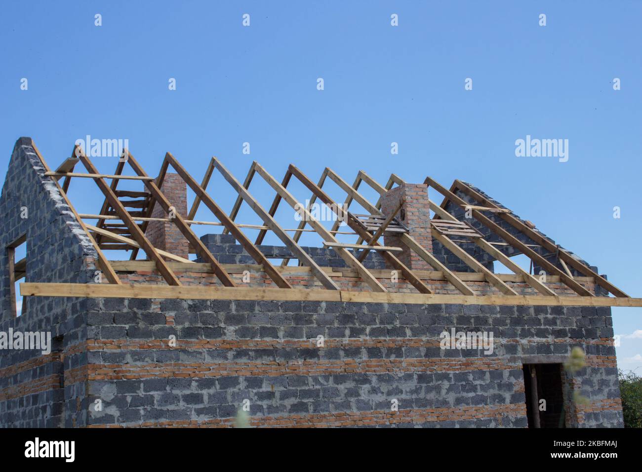 Structure of a wooden house under construction, in French. Stock Photo