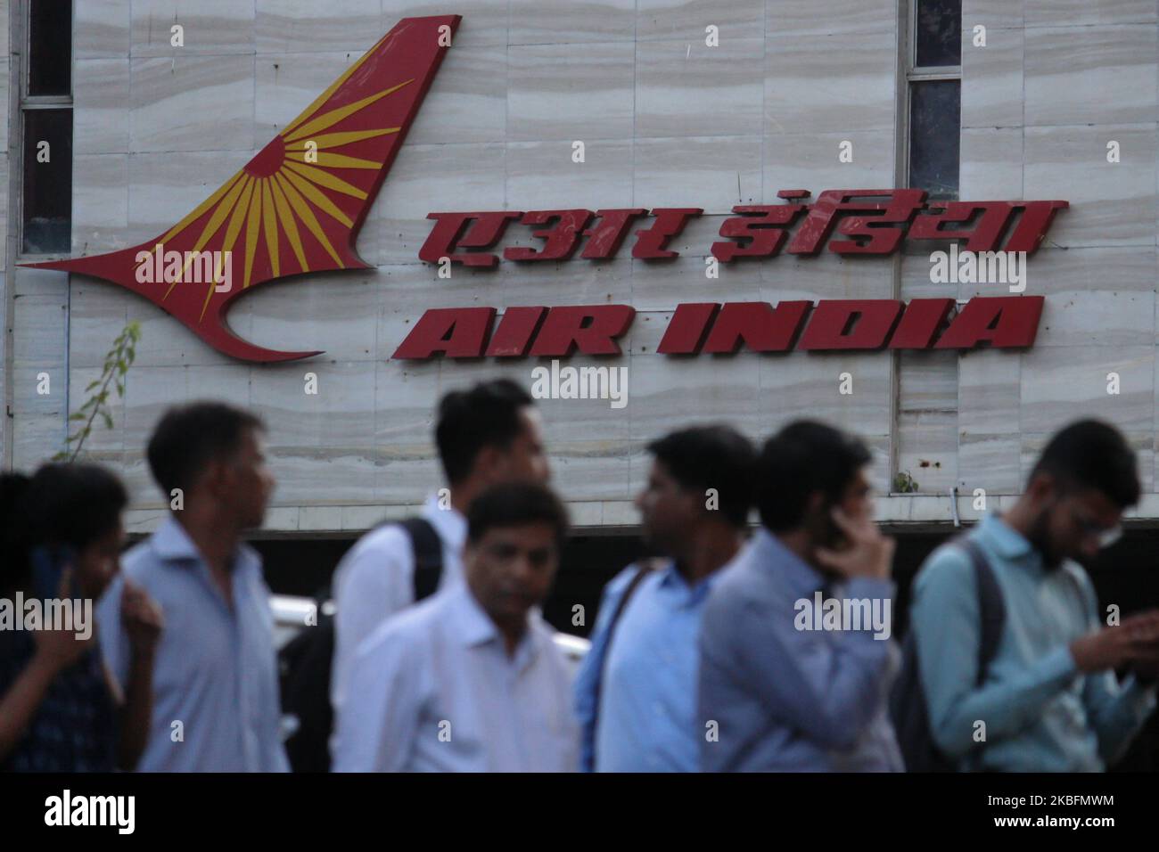 People walk past an Air India logo outside its building in Mumbai, India on 28 January 2020. (Photo by Himanshu Bhatt/NurPhoto) Stock Photo