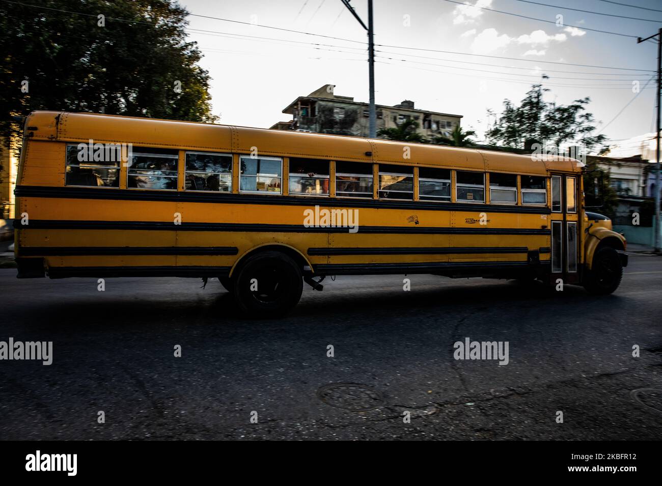 A school bus in Vedado, Cuba, on January 17, 2020. The city attracts milions of tourists annually. Old Havana (Habana Vieja) is declared a UNESCO World Heritage Site. (Photo by Manuel Romano/NurPhoto) Stock Photo