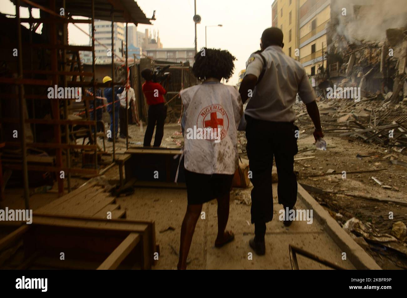 A Red Cross official is been rushed down for treatment after a fire broke out in a section of the balogun market in Lagos Island on January 29, 2020. (Photo by Olukayode Jaiyeola/NurPhoto) Stock Photo