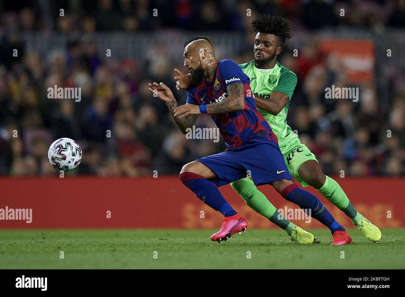 Arturo Vidal of Barcelona and Chidozie Awaziem of Leganes battle for the ball during the Copa del Rey round of 16 match between FC Barcelona and Leganes at Camp Nou on January 30, 2020 in Barcelona, Spain. (Photo by Jose Breton/Pics Action/NurPhoto) Stock Photo