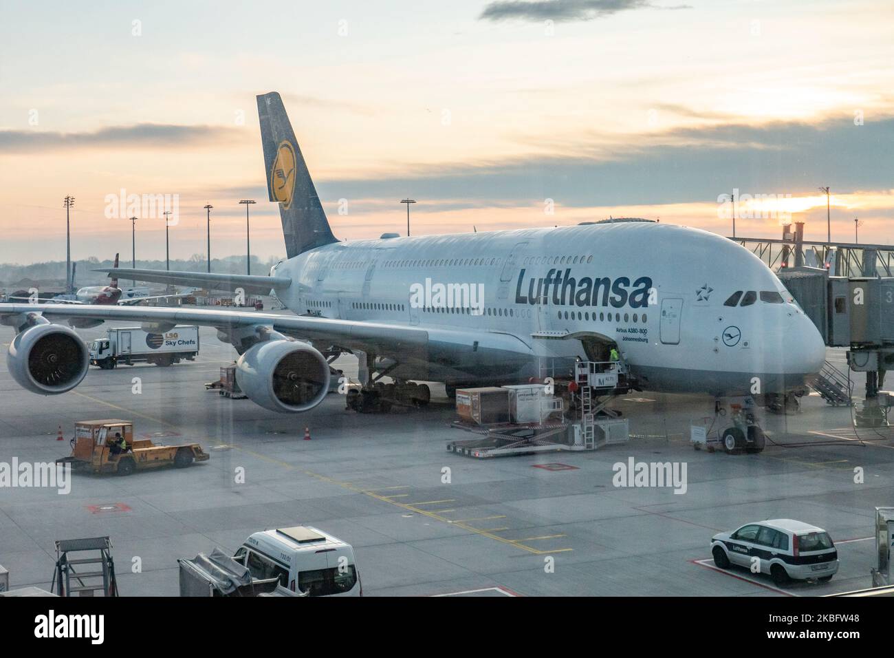 A double decker Airbus A380 aircraft with registration D-AIME and the name Johannesburg as seem docked at the terminal of Munich Airport read for long haul flight. Early morning airplane traffic movement of Lufthansa aircraft with their logo visible on the tarmac and docked via jetbridge or air bridge at the terminal at Munich MUC EDDM international airport in Bavaria, Germany, Flughafen München in German. Deutsche Lufthansa DLH LH is the flag carrier and largest airline in Germany using Munich as one of their two hubs. Lufthansa is a Star Alliance aviation alliance member. January 26, 2020 (P Stock Photo
