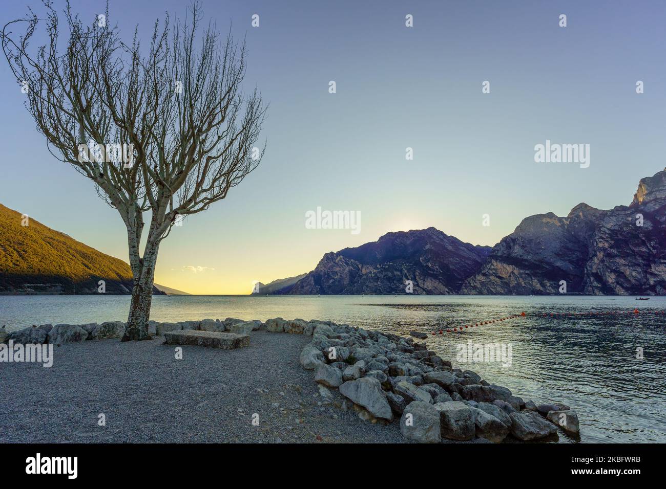 Sunset view of the north shore of Lake Garda, on a clear winter day, in Nago–Torbole, Trentino, Northern Italy Stock Photo
