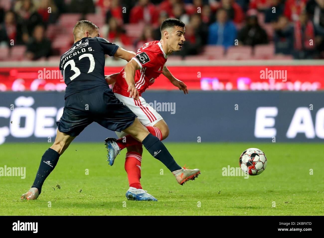 Chiquinho of SL Benfica (R ) vies with Goncalo Silva of Belenenses SAD and shoots to score during the Portuguese League football match between SL Benfica and Belenenses SAD at the Luz stadium in Lisbon, Portugal on January 31, 2020. (Photo by Pedro FiÃºza/NurPhoto) Stock Photo