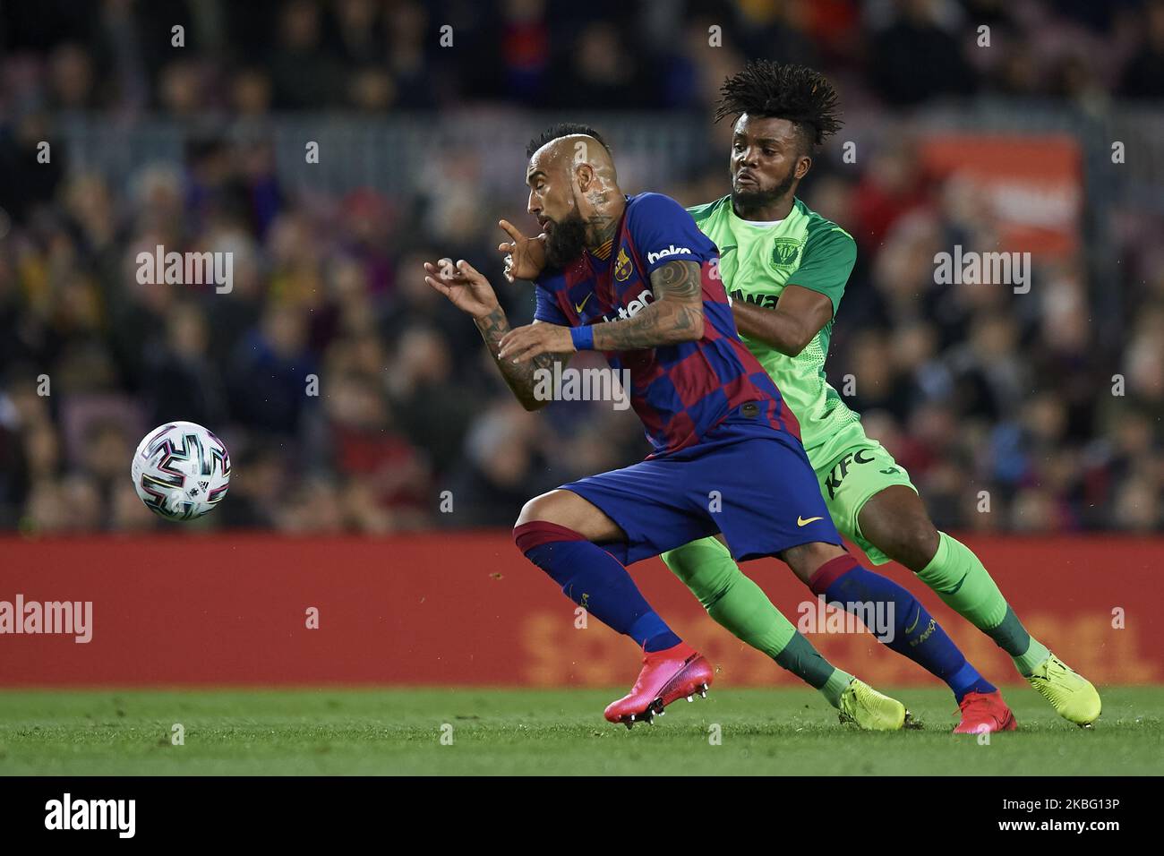 Arturo Vidal of Barcelona and Chidozie Awaziem of Leganes competes for the ball during the Copa del Rey round of 16 match between FC Barcelona and Leganes at Camp Nou on January 30, 2020 in Barcelona, Spain. (Photo by Jose Breton/Pics Action/NurPhoto) Stock Photo