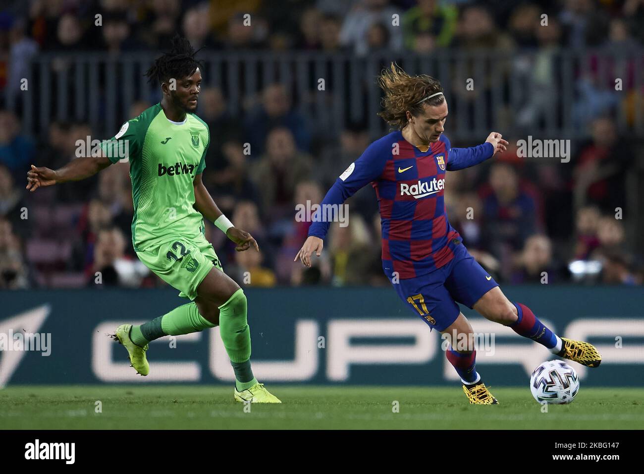 Antoine Griezmann of Barcelona and Chidozie Awaziem of Leganes competes for the ball during the Copa del Rey round of 16 match between FC Barcelona and Leganes at Camp Nou on January 30, 2020 in Barcelona, Spain. (Photo by Jose Breton/Pics Action/NurPhoto) Stock Photo