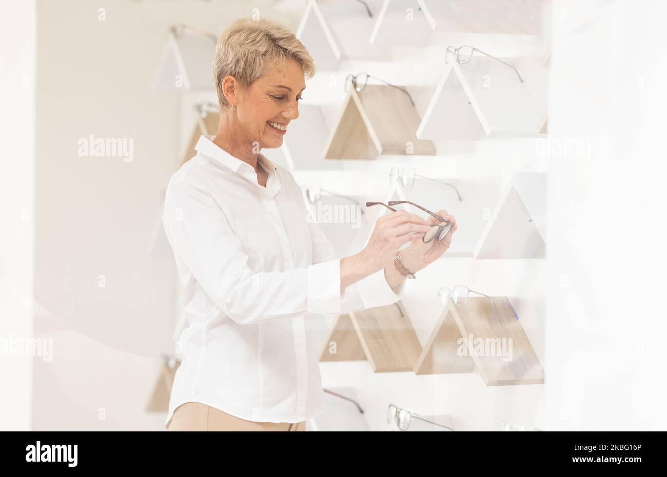 Optometry, shopping and senior woman choosing a new frame at a modern