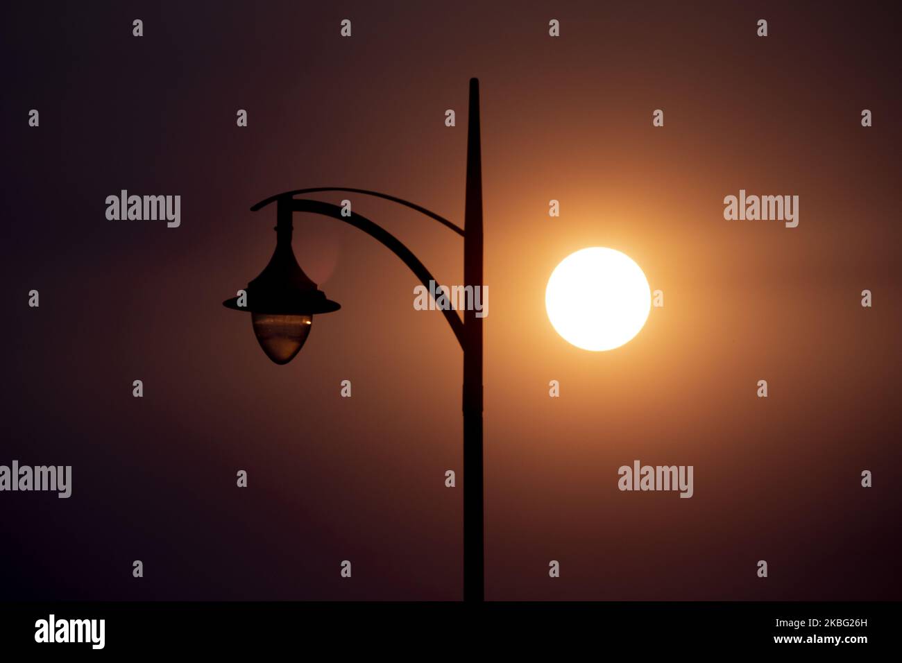 The sun shrouded by a haze of smoke is seen inÂ Christchurch, New