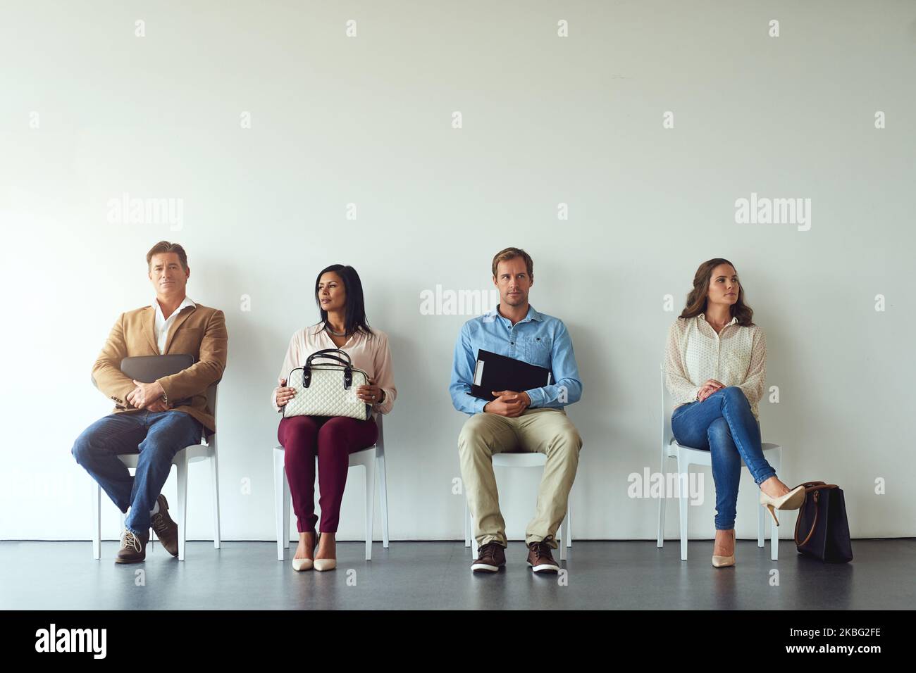 One of them is the ideal candidate. a diverse group of people sitting ...