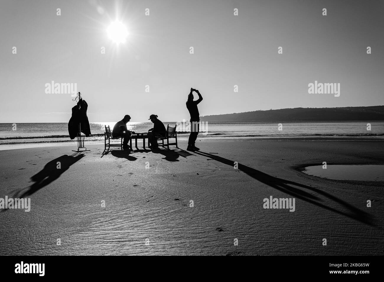 Bulgaria Winter High Temperature Record Broken Bulgarians enjoy themselves on a sunny winter day at the Varna beach, some 450 km to the East of the Bulgarian capital Sofia, on Feb. 3, 2020. Temperatures of the are expected to soar at 20 degrees in Celsius (68 in Fahrenheit). A more then 50 years' high temperature record was broken on Feb 2, as the temperature reached 19 degrees in Celsius (some 66 in Fahrenheit). The weather is supposed to be unusually warm for the next 3-4 days. (Photo by Petko Momchilov/Impact Press GroupNurPhoto) Stock Photo